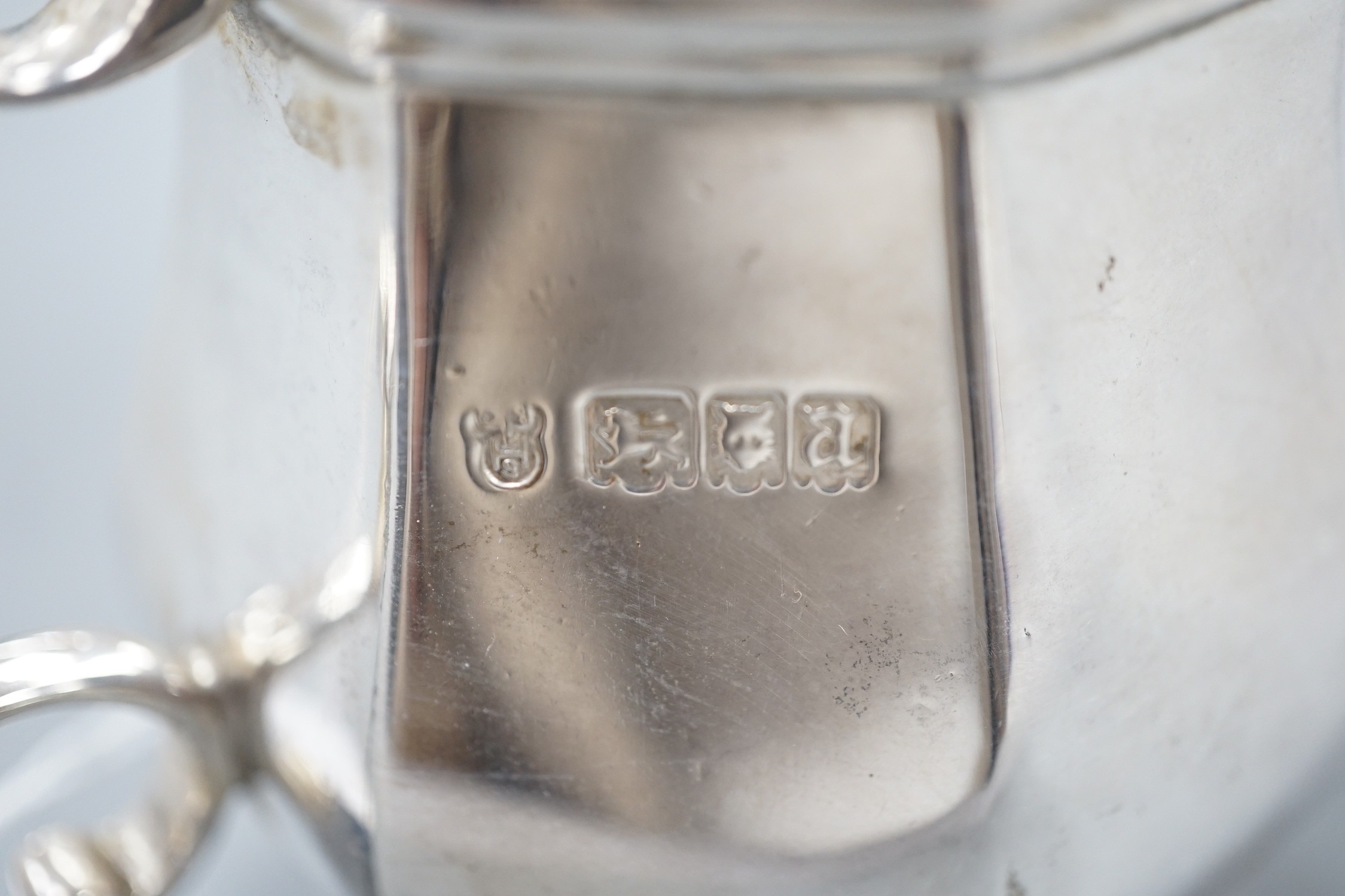 A George V silver panelled cream jug, Charles Stuart Harris & Sons, London, 1916, 82mm, 6.5oz.